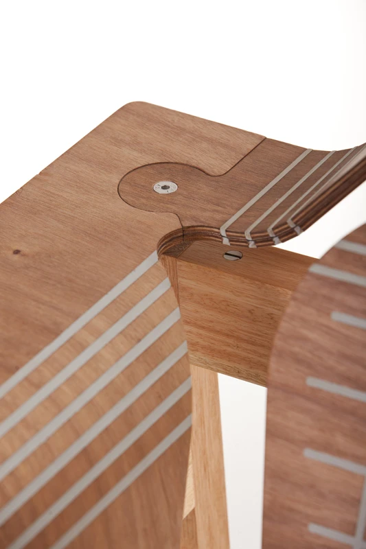 The plywood is scored and the gaps filled with flexible polymer, meaning the wood can be bent and shaped as needed