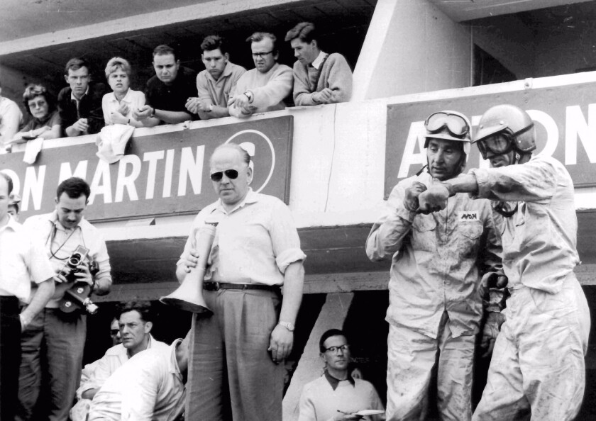 Roy Salvadori and Carroll Shelby await a pit stop during the 1959 Le Mans 24 hour race