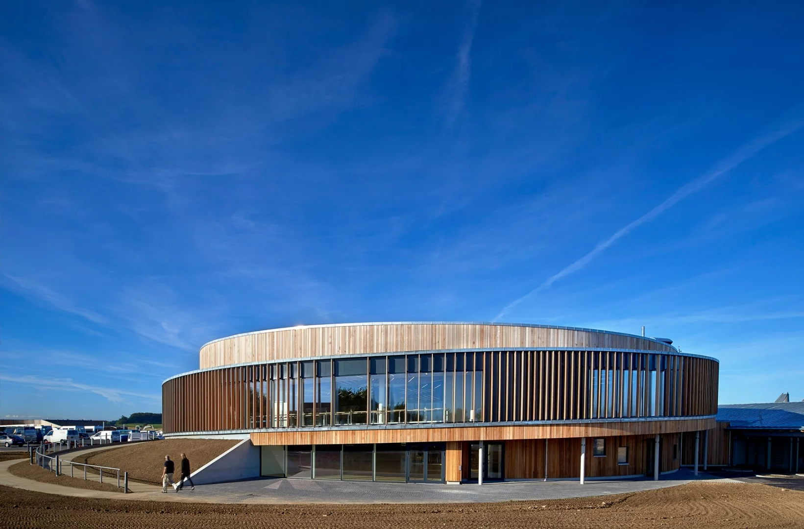 The buiding containing the sports hall at Musholm is circular and features a 100-m (328-ft) spiralling ramp is wrapped around the outside