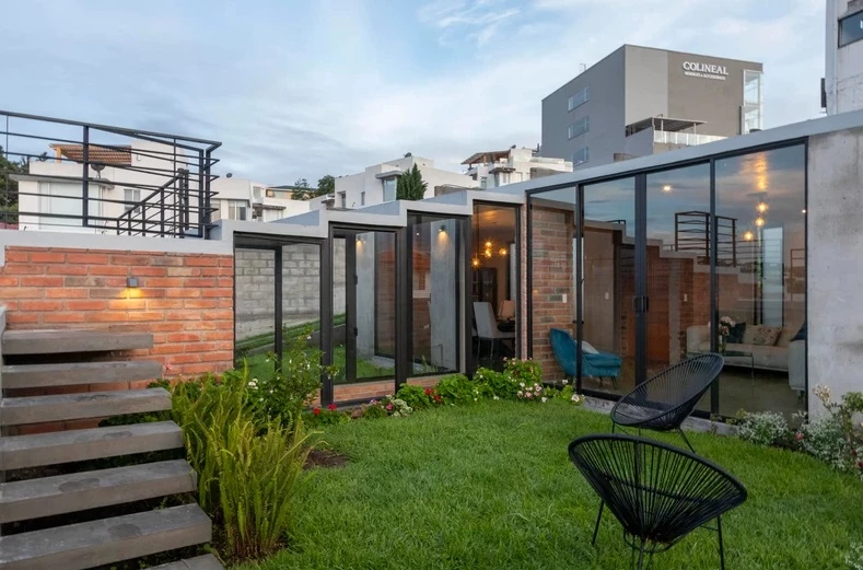 Three separate buildings are interconnected through interior and exterior pathways