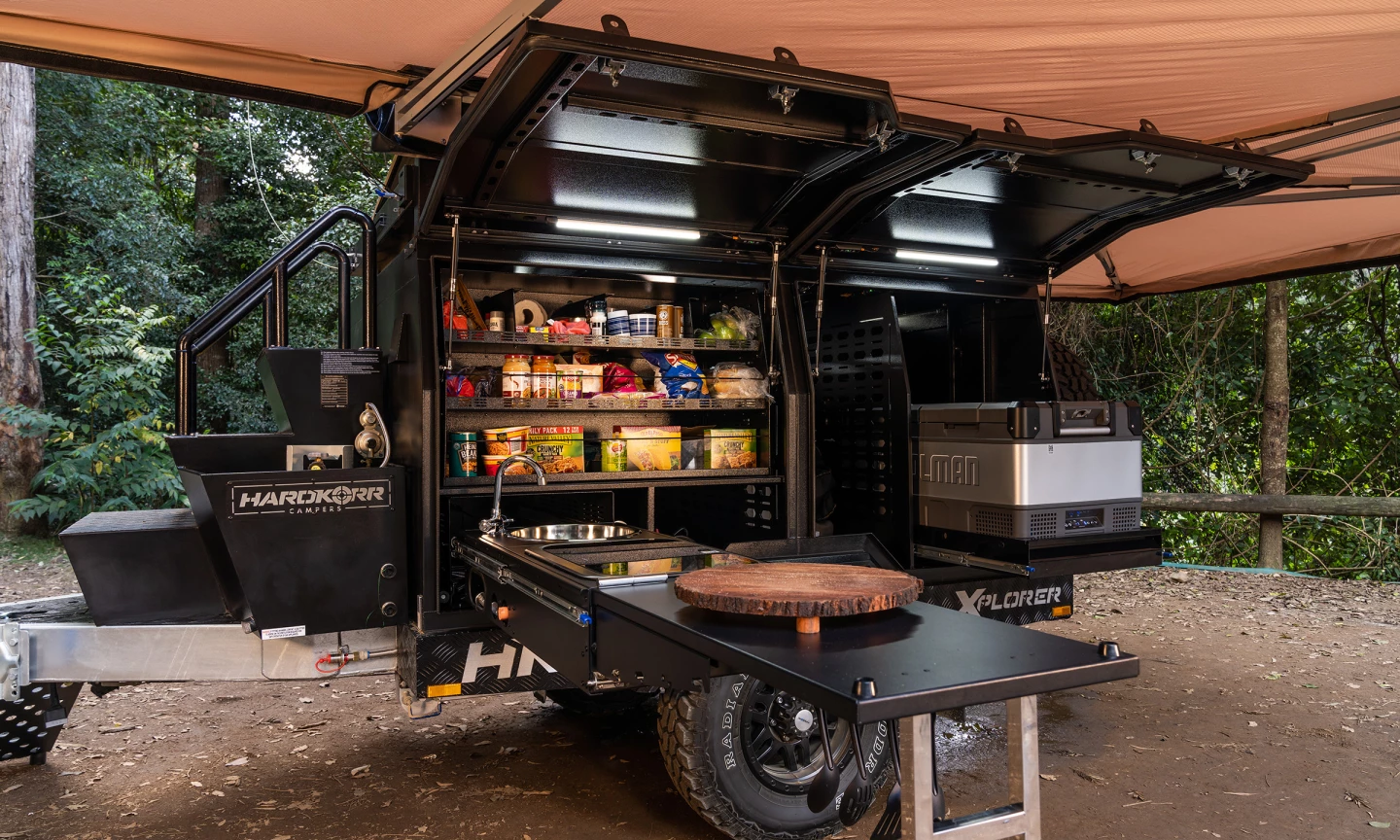 The lefthand side of the trailer is designed to accommodate the available slide-out kitchen, pantry and fridge/freezer
