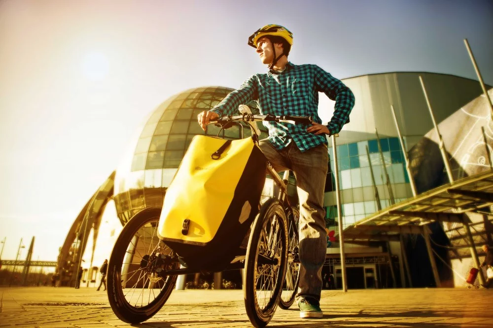 Noomad accessories include a pannier, child seat and wicker basket