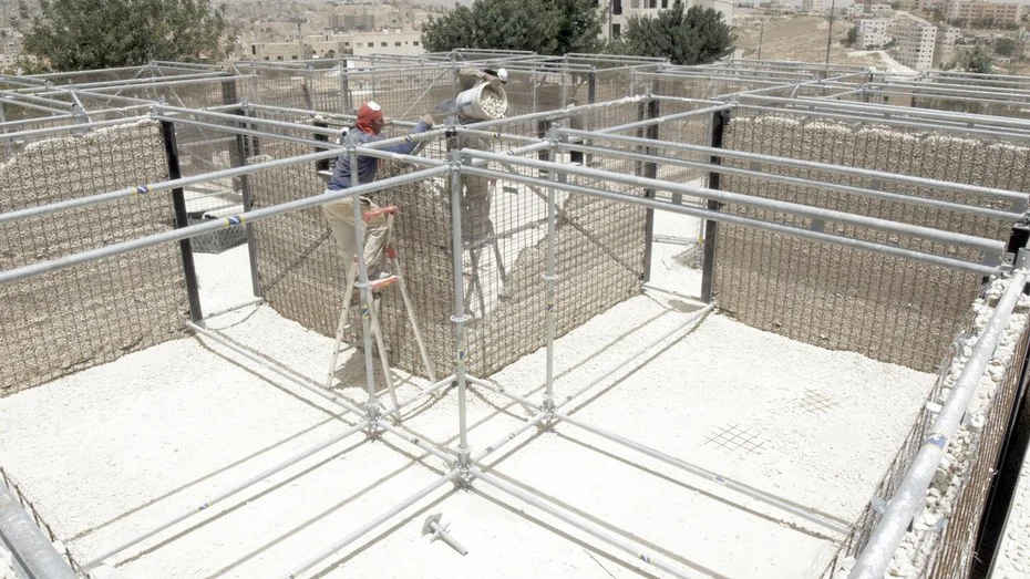 Re:Build's floor is made from plywood panels, and the buildings also have a basic rainwater catchment system