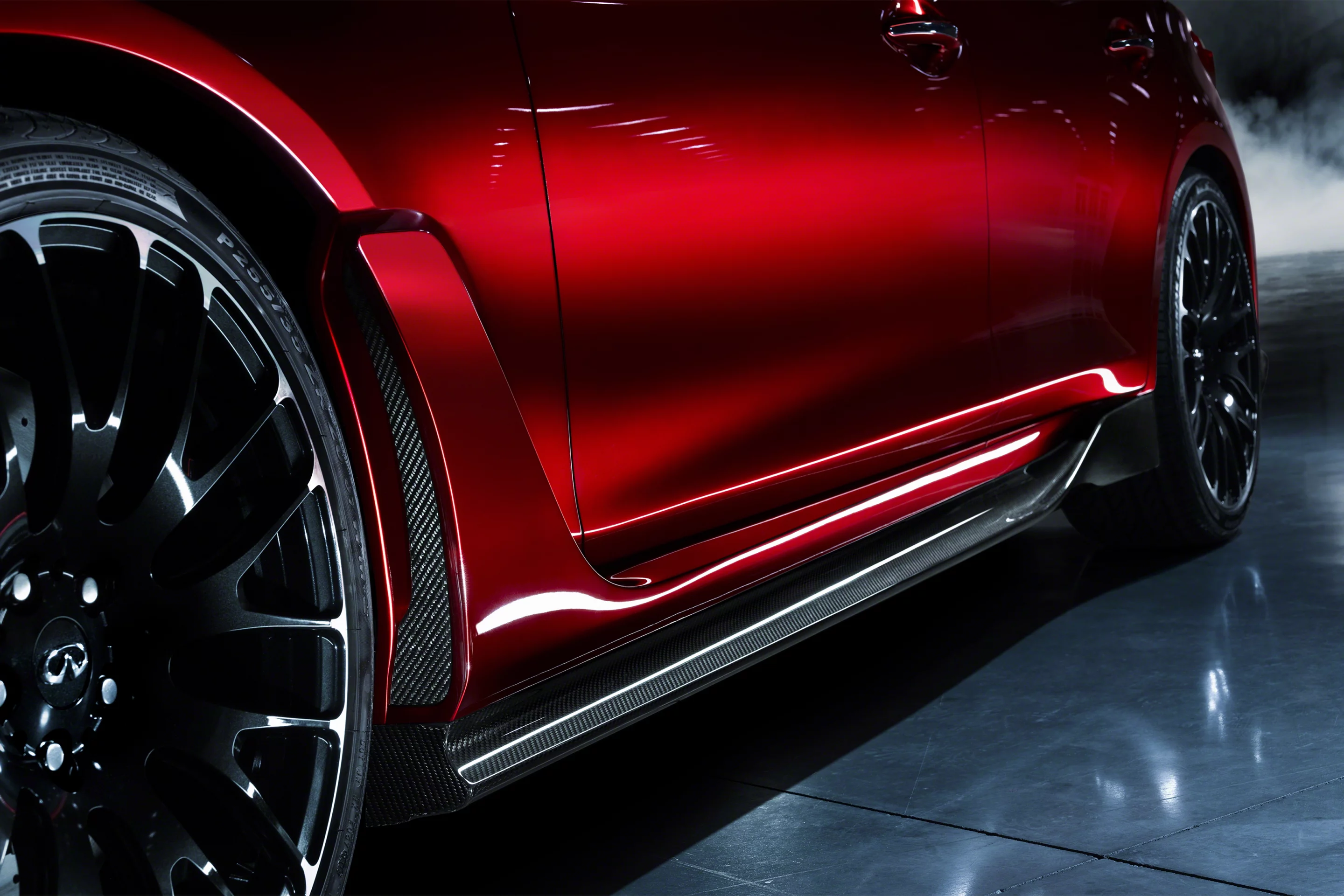 Down at ankle level, new carbon fiber sculpted aero-sections run the distance between the flared arches and 21 inch forged wheels