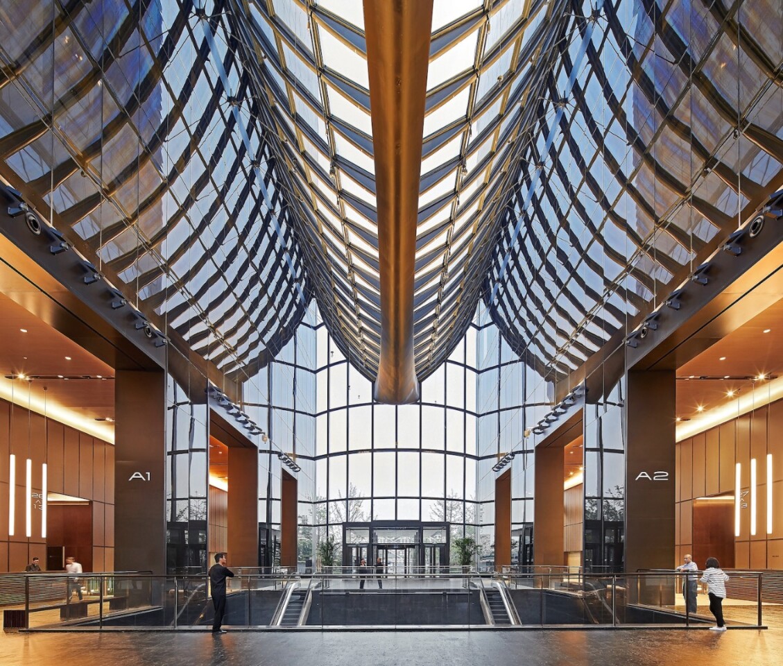 The Chaoyang Park Plaza's towers are joined by a glass atrium