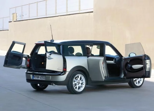 MINI's new Clubman, showing off the "club door" on the passenger side that poens for easy access to the back seats.