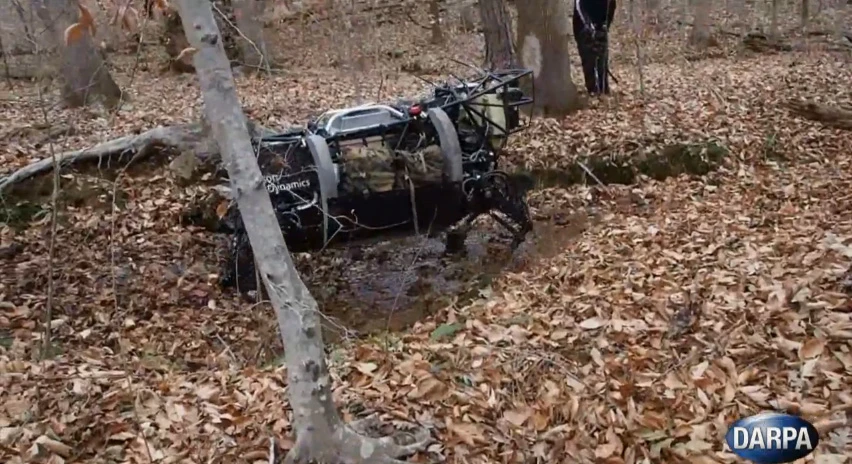 No worse for wear, DARPA's LS3 lands in a mud puddle during a training exercise from the fall, 2012