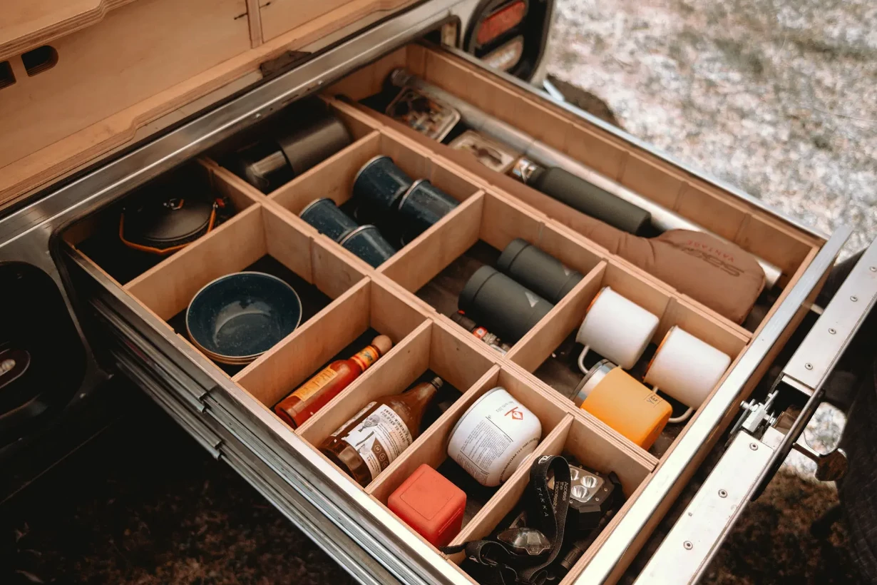 The wide rear drawer down low features adjustable dividers for storing all kinds of critical (or not-critical) gear
