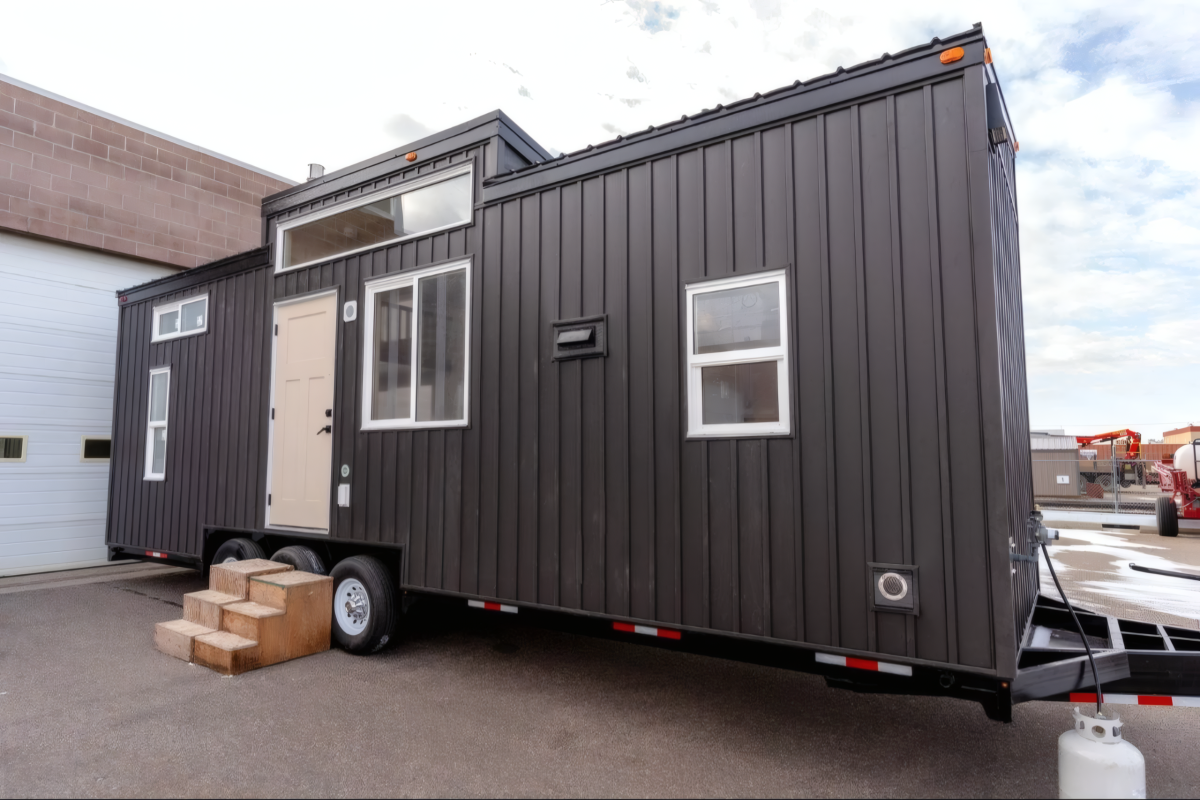 Family friendly tiny house fits two bedrooms in a towable frame