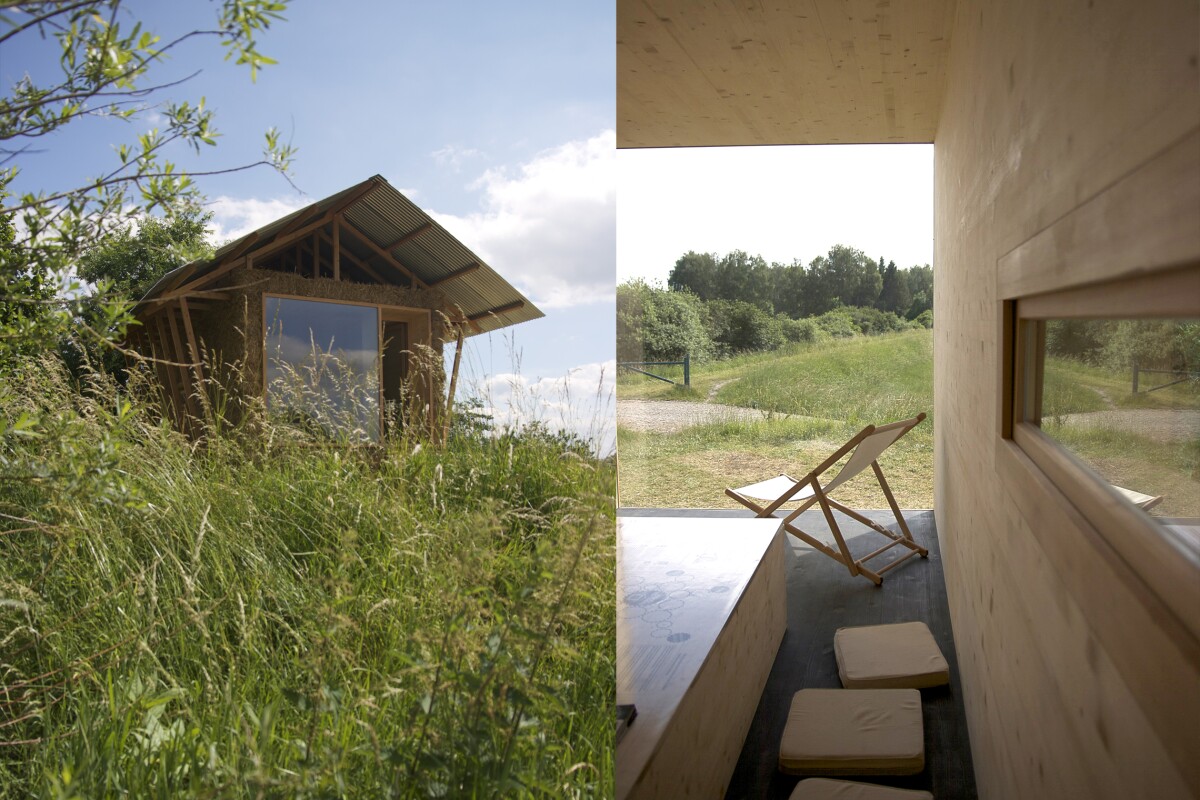 A large open glass window opens out onto the surrounding landscape, while a long side window has perhaps been designed with bird-watching in mind