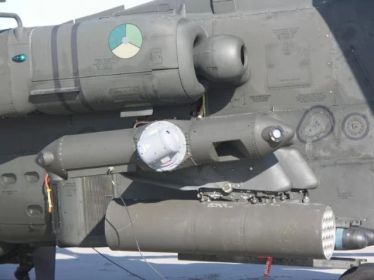 The small pod containing Northrop Grumman's laser Directional Infrared Countermeasures (DIRCM) system mounts to the end of the stub-wing on the Apache AH-64D attack helicopter. The system successfully thwarted a series of simulated heat-seeking missile at