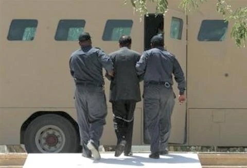 Saddam makes the return journey in the safety of the Rhino