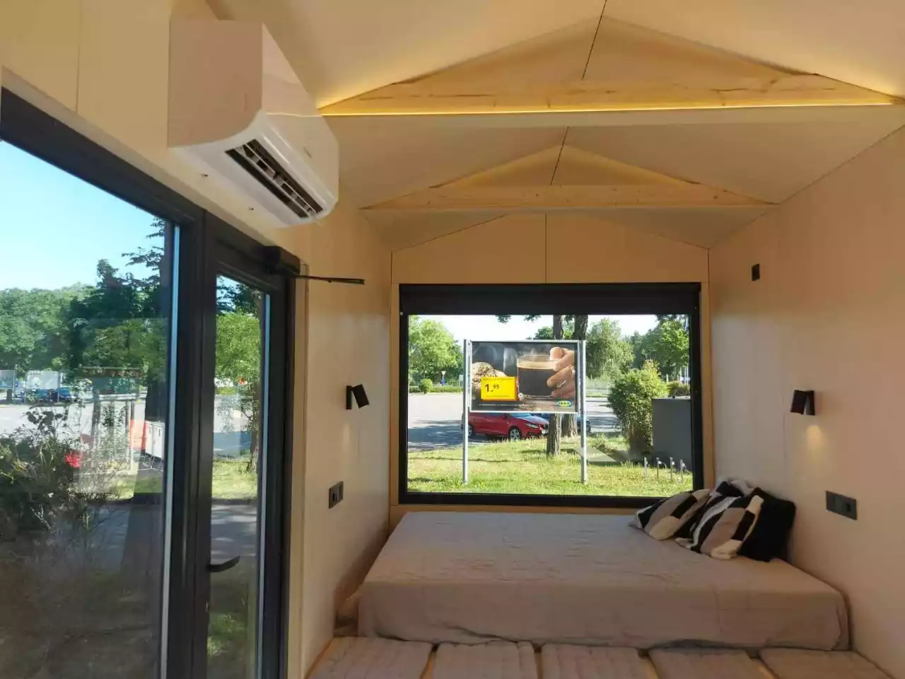 The BTH Single's living/sleeping area includes bench seating and a slightly raised double bed