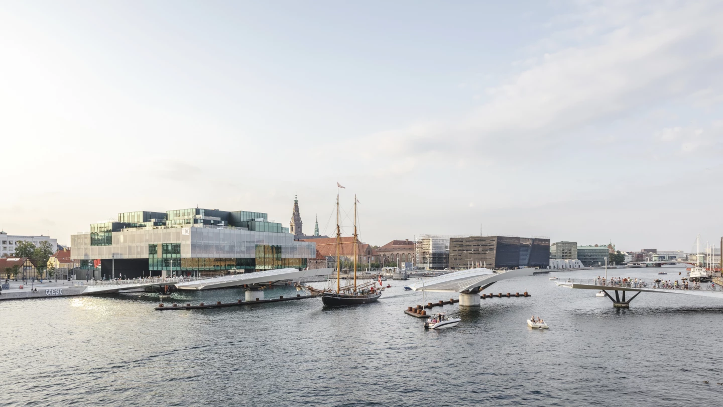 The Lille Langebro bridge features rotating central sections that turn sideways, allowing ships to pass