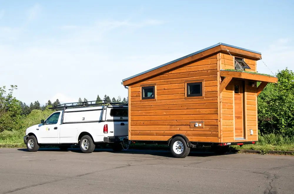 The Salsa Box comes equipped with a queen-sized bed, a flushing toilet, a combined shower and mini-tub, and a kitchenette
