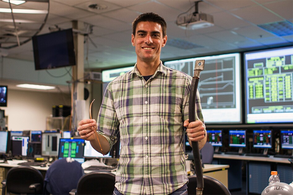 MIT PhD candidate Brandon Sorbom holds REBCO superconducting tapes (left), which are the enabling technology behind the ARC reactor