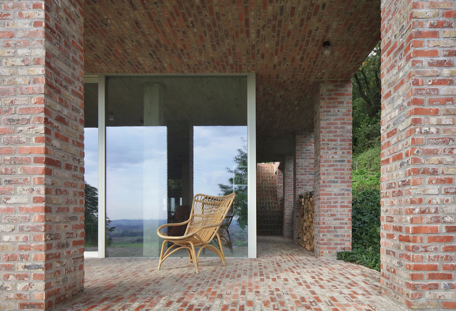 The contemporary family home uses reclaimed-bricks