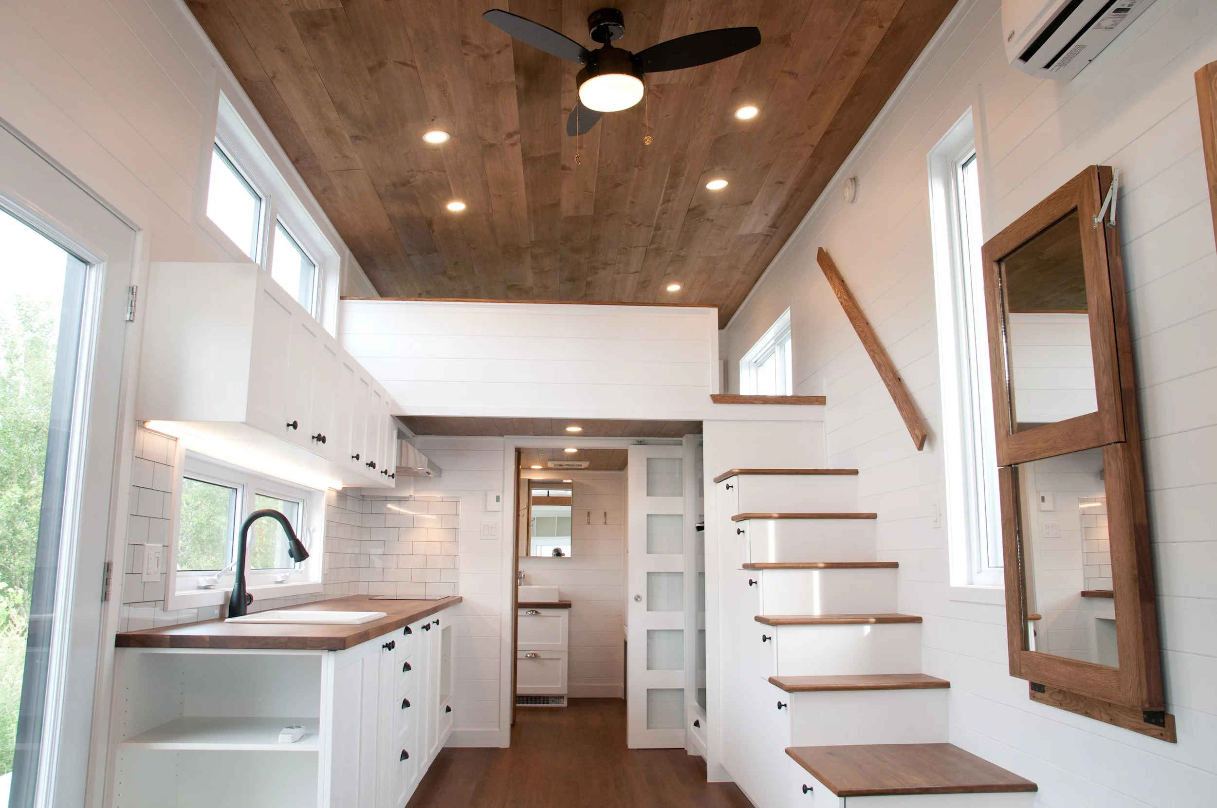 The Ébène V3's wall-mounted mirror drops down to become a dining table