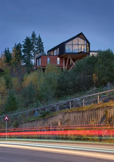 House Dokka is suspended above the ground to minimize interference with the surrounding environment