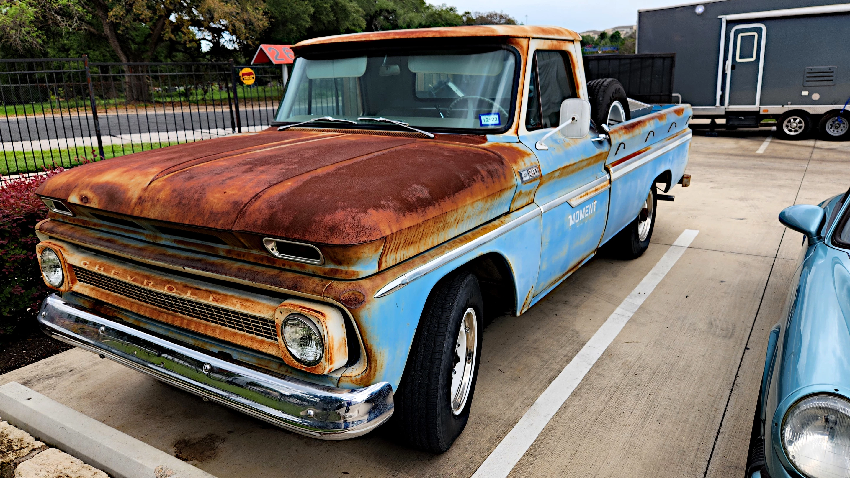 Moment Motors' Chevrolet C20 shop truck parked in front of company headquarters in Austin, Texas