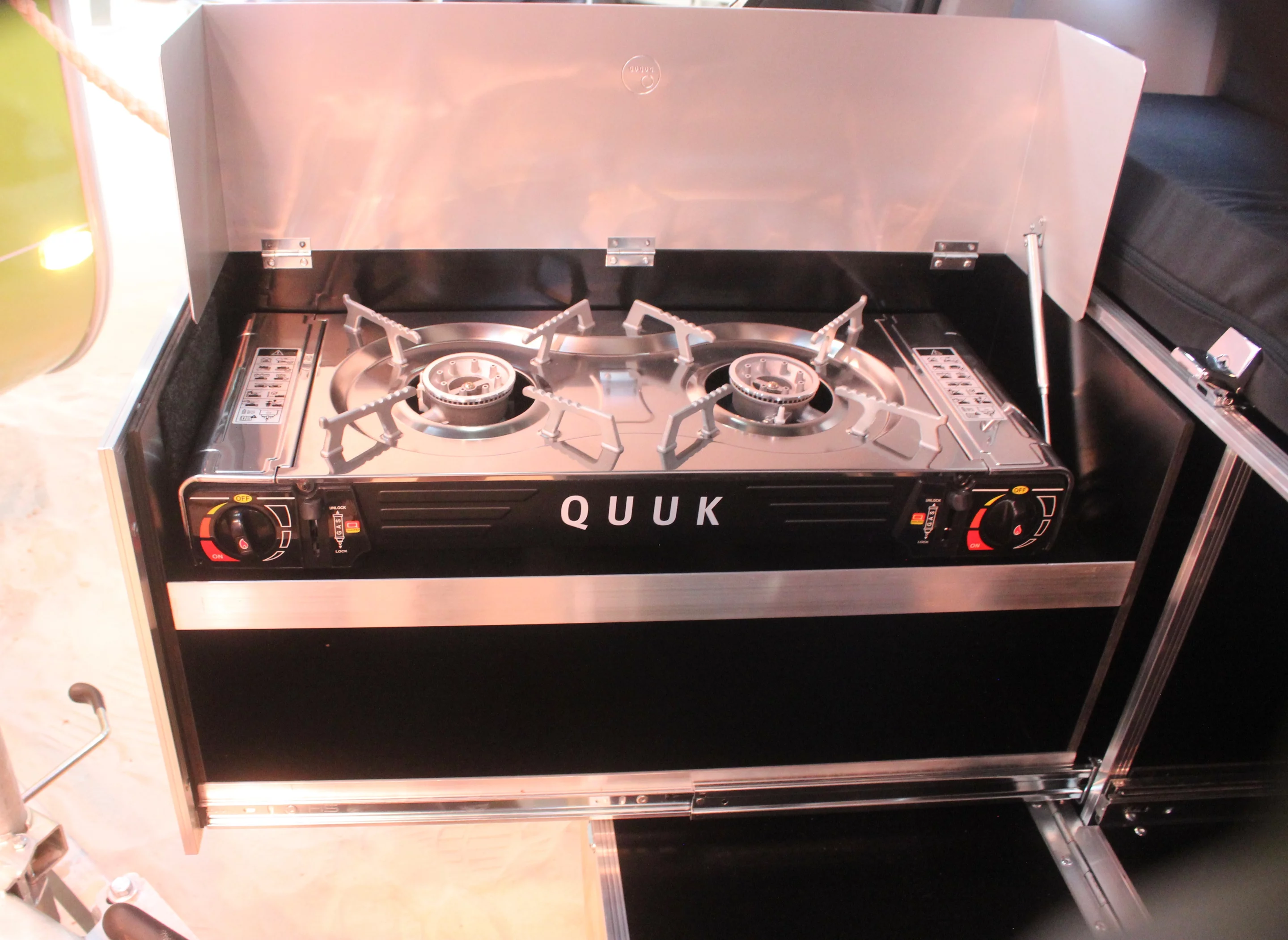 Ququq's driver-side slide is designed to hold a dual-burner stove
