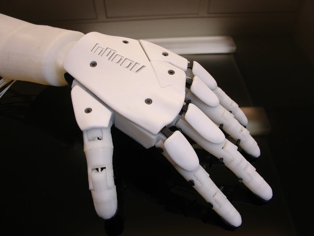 InMoov's hand contains dozens of parts, but is cheap enough that most people can build one with access to a 3D printer
