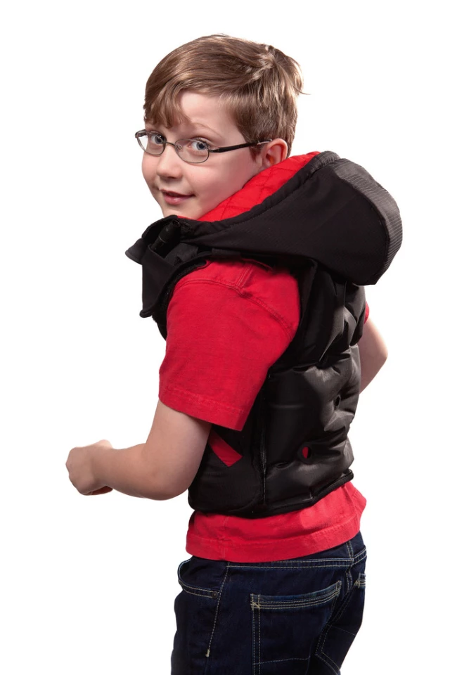 The Snug Vest is made to sit just above the wearer's hips so that it does not ride up on their shoulders when they sit (since that would impact on the deep pressure therapy)