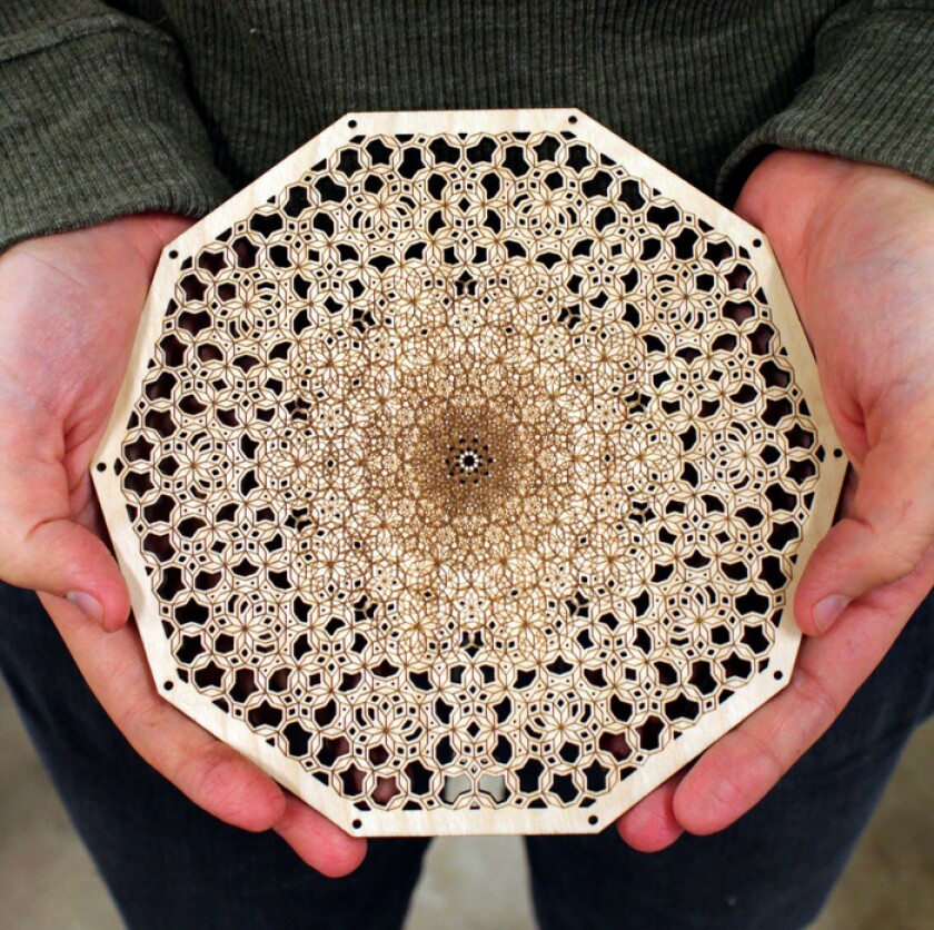 A sample of the Origami's work shining a powerful light on wood