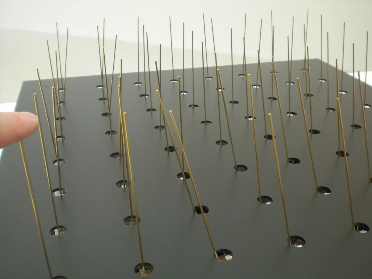 Cilium is a carpet of vertical wires that collectively move towards your finger when you touch one of the tips (Photo: Stephen Clemenger/Gizmag.com)