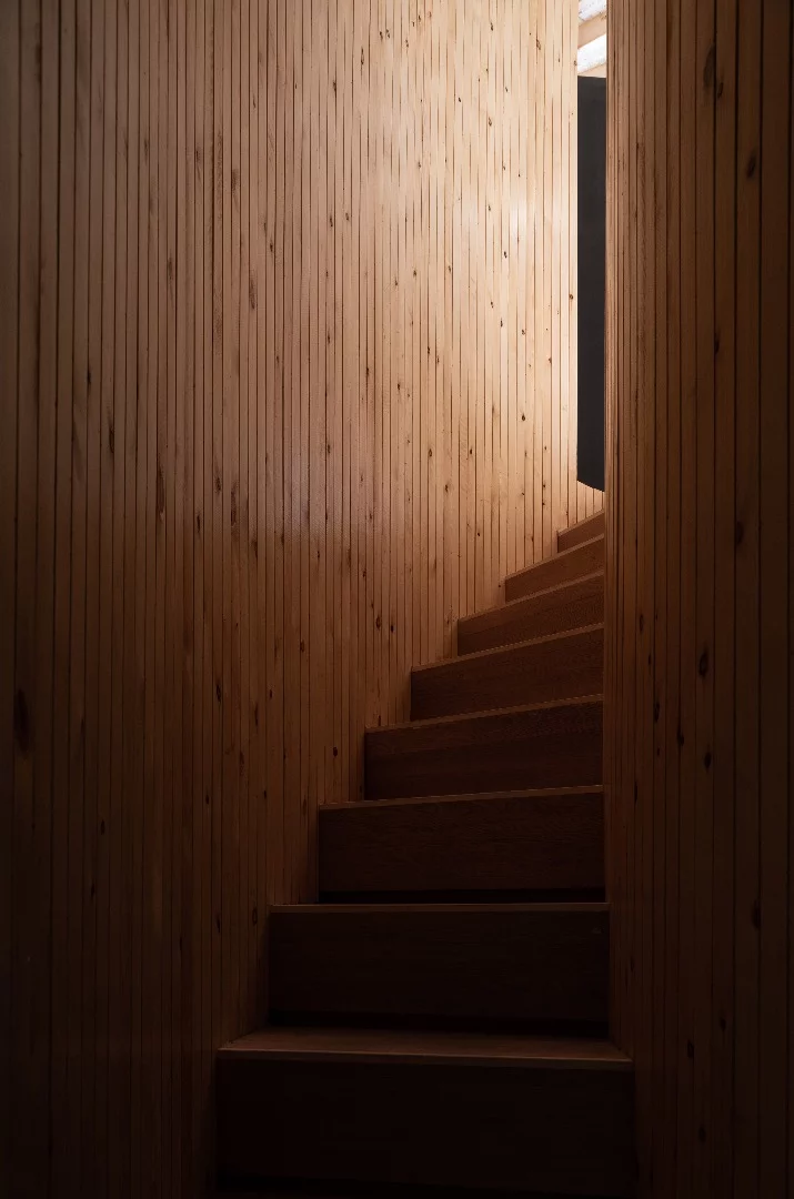 A spiral staircase leads to the Treewow Villa O's rooftop terrace area