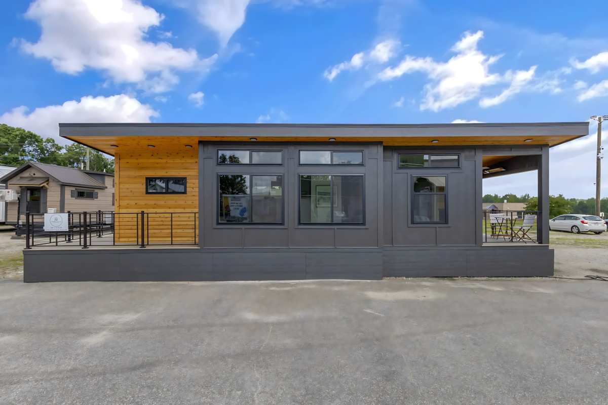 Tiny house spreads out with a pair of porches and a spacious interior