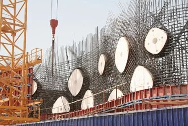 The O-14 was created using high-strength, self-consolidating concrete cast around steel mesh reinforcement. The holes are achieved by introducing computer numerically cut polystyrene void forms into the mesh rebar matrix