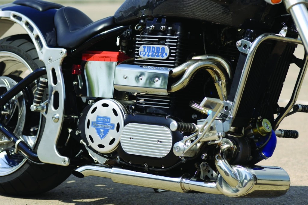 We first became aware of Neander-Motors more than a decade ago when its highly unorthodox diesel engine was demonstrated in a motorcycle. Sadly, the benefits of the design were lost among the eccentricities of the motorcycle marketplace where small unconventional manufacturers are plentiful.