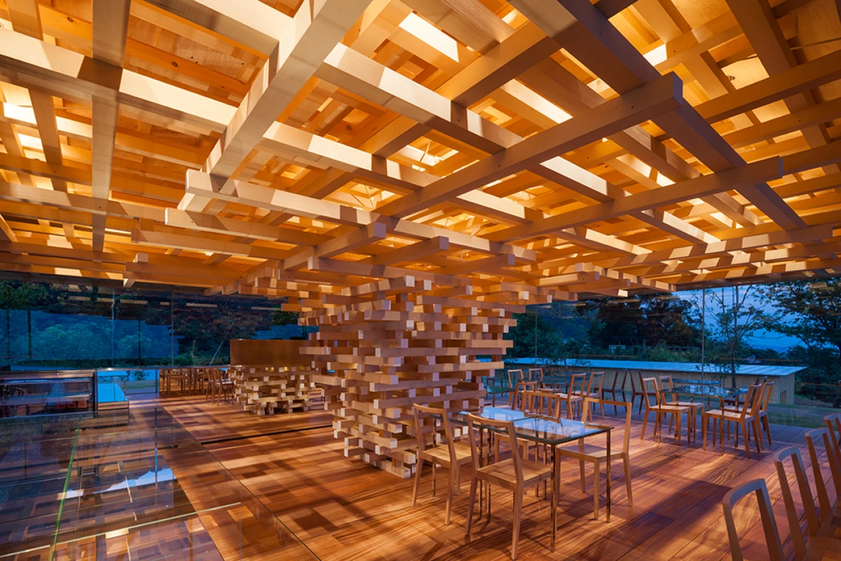 The Coeda House café takes its design cues from a tree, and uses a stack of cedar blocks as its "trunk"