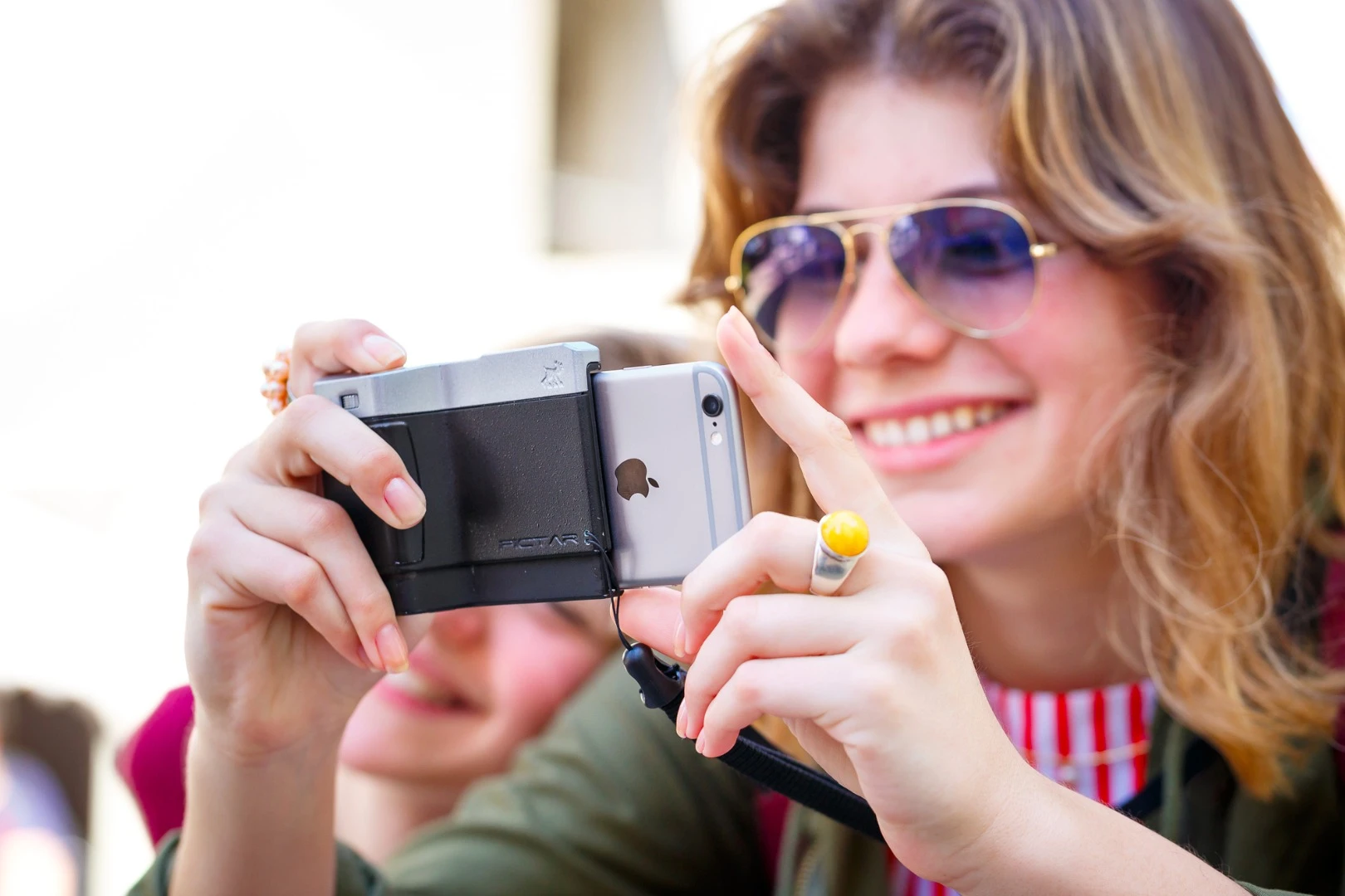 The Pictar has a molded hand grip along with several button controls