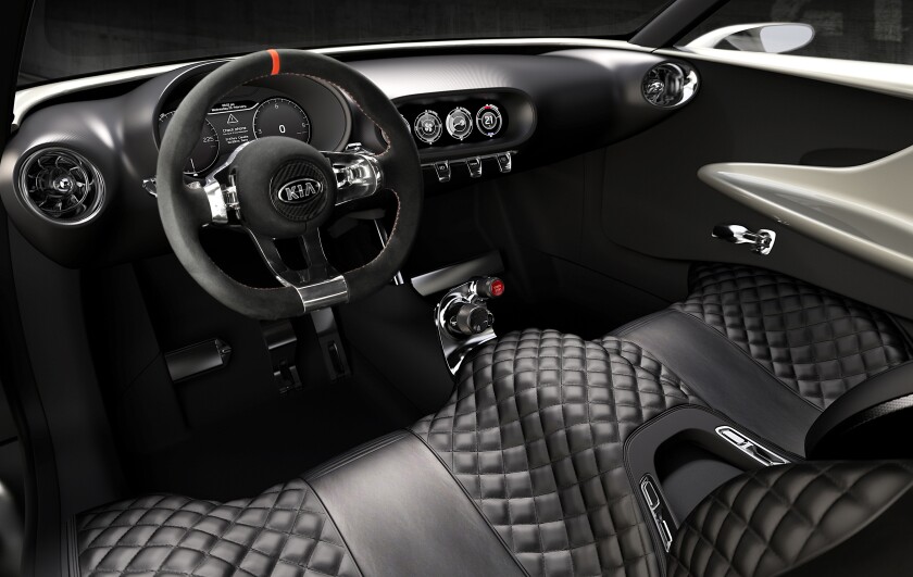 Kia creates an open feel in the interior with fixed bench seating and a floating dashboard