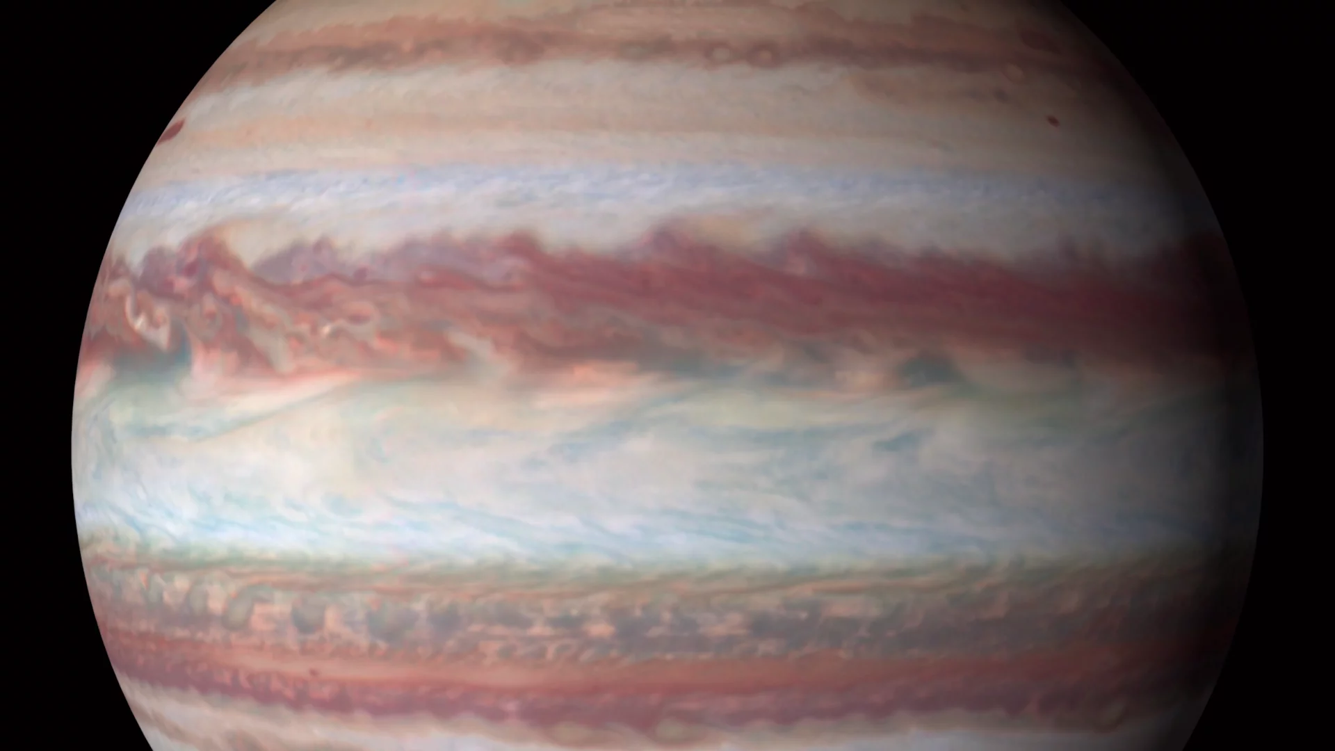 The photos are the first in a series of yearly 4K portraits of our solar system's outer planets and reveal a pair of intriguing features on Jupiter