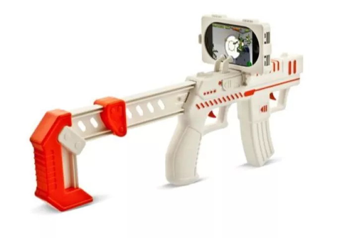 The appBlaster is an iPhone accessory that allows you to shoot at virtual aliens in your real-life surroundings, via the Alien Attack augmented reality app(Photo: RED5)