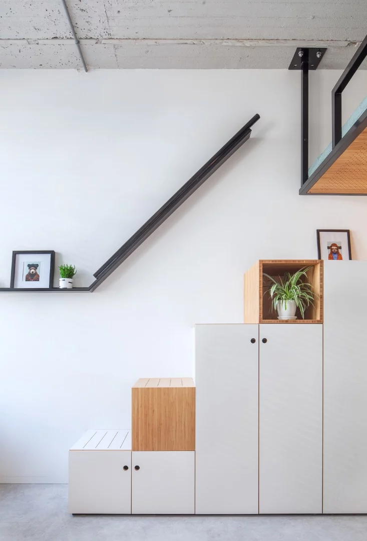 The Hermes City Plaza apartments have integrated storage units that cleverly double up as a staircase