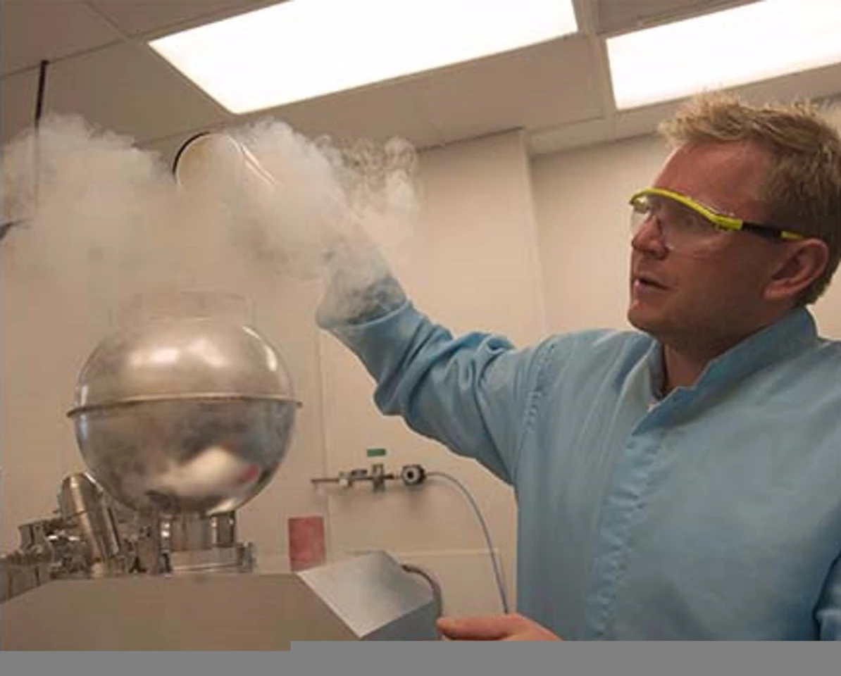 Scripps Professor James Day analyzes glass formed from nuclear test explosion