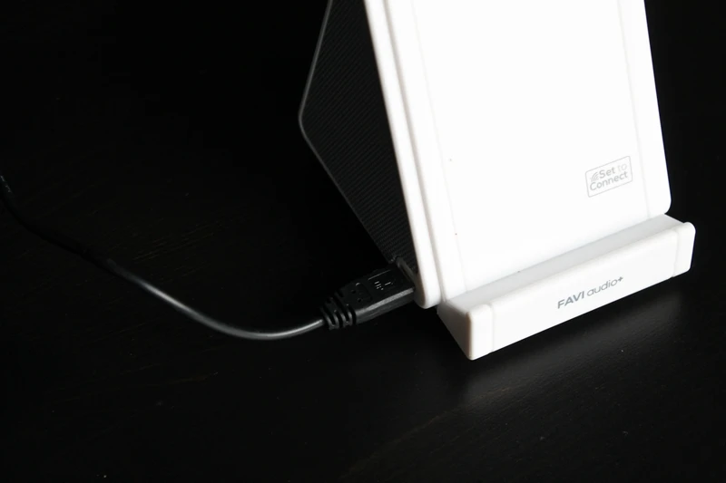 The speaker connects to a computer for charging