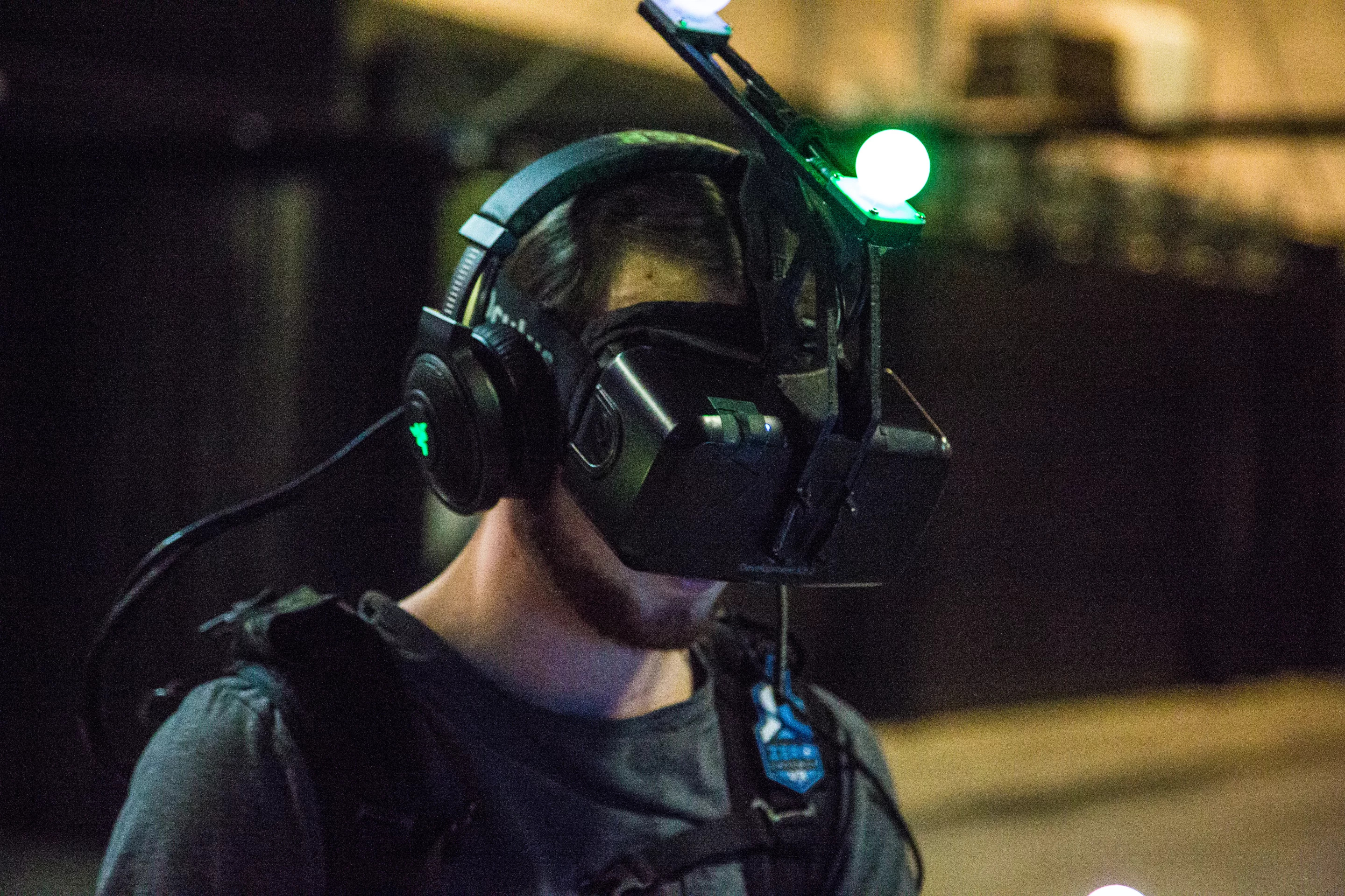 The headset is an Oculus Rift DK2, with a custom attachment that holds two Playstation Move orbs that allow for head tracking