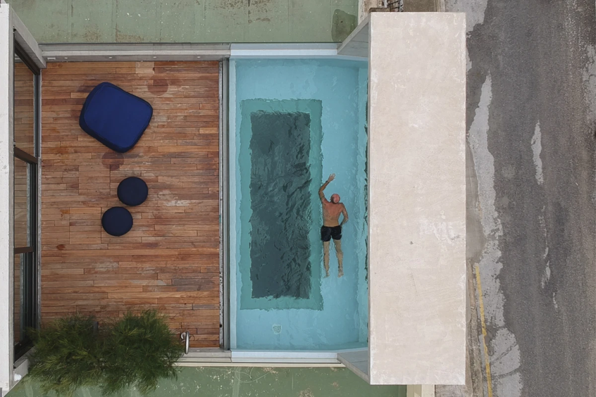 Casa B's rooftop pool offers a view of the home's interior below