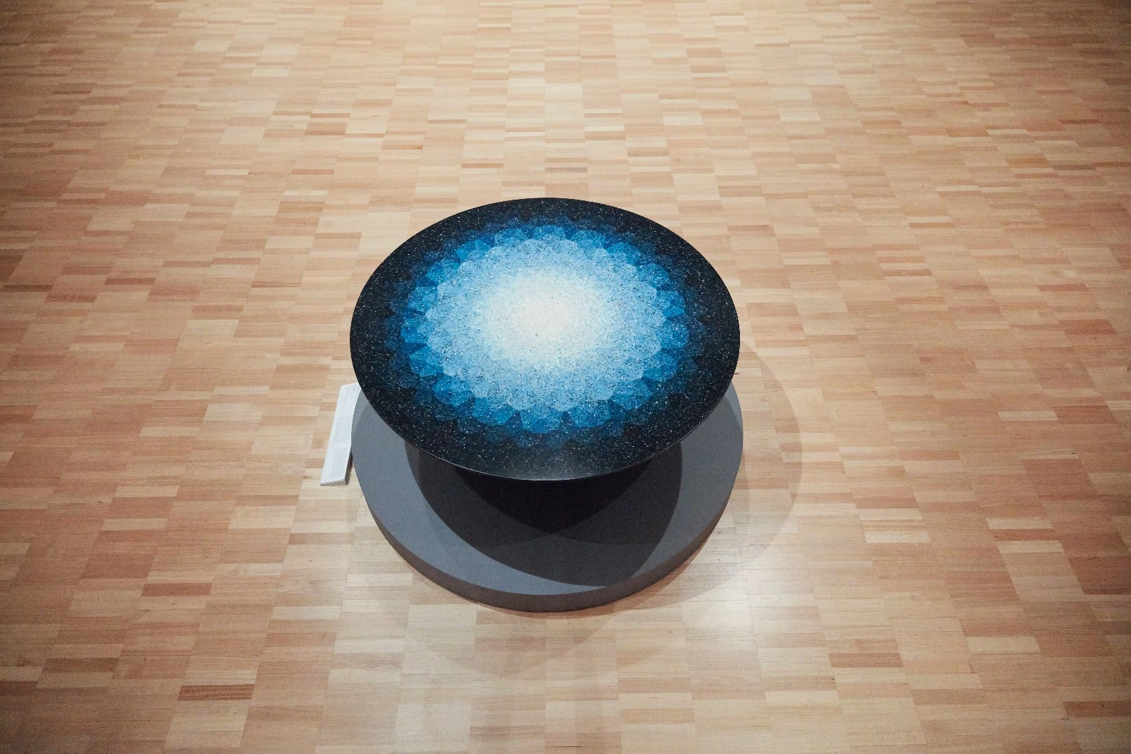 Brodie Neill recreated a terrazzo style on this table using waste plastic particles found in the ocean. The overall pattern depicts our planet's longitudinal and latitudinal lines while commenting on the extraordinary waste plastic that is strewn into our oceans every year