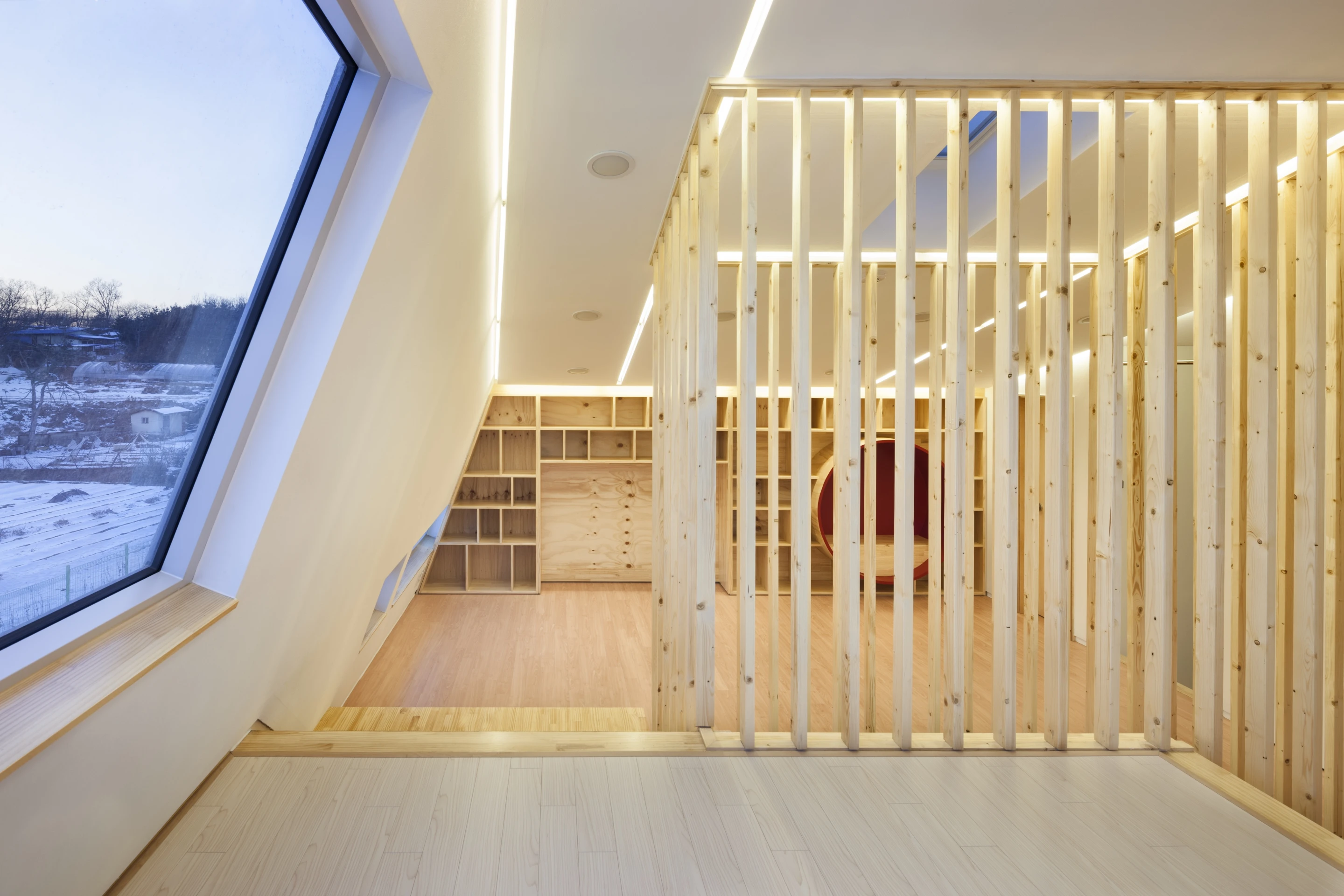 The interior features a clean, almost utilitarian finish with plenty of plain wood (Photo: Namgoong Sun)