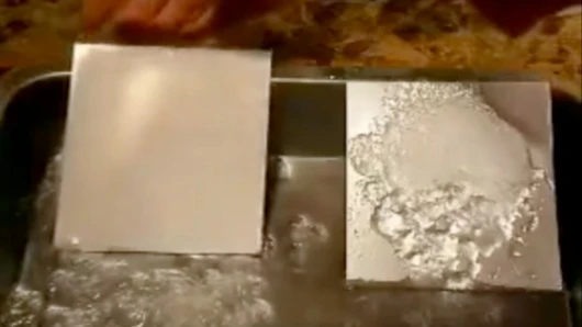 The surface on the left coated in the superhydrophobic coating is devoid of ice, while the uncoated surface is almost completely covered
