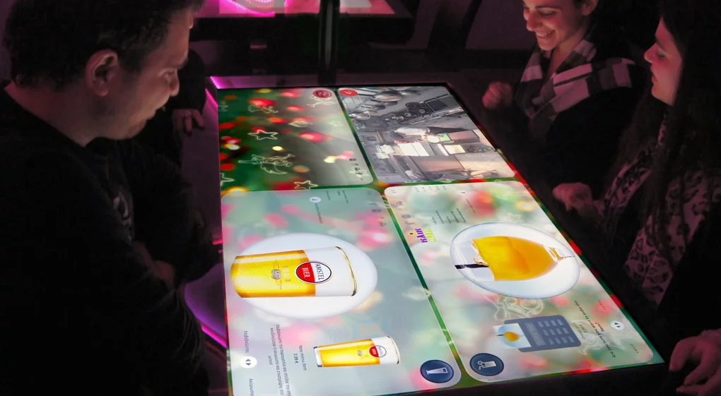 While they're waiting for their food to arrive, patrons can use the table to do things like play games, read news, or chat with diners at other tables