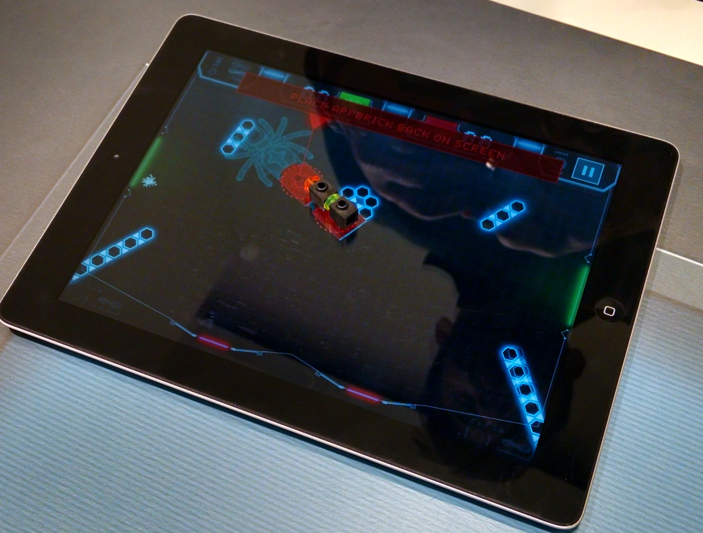 We use this Lego app brick to swat bugs into a goal in the accompanying tablet game (Photo: C.C. Weiss/Gizmag)