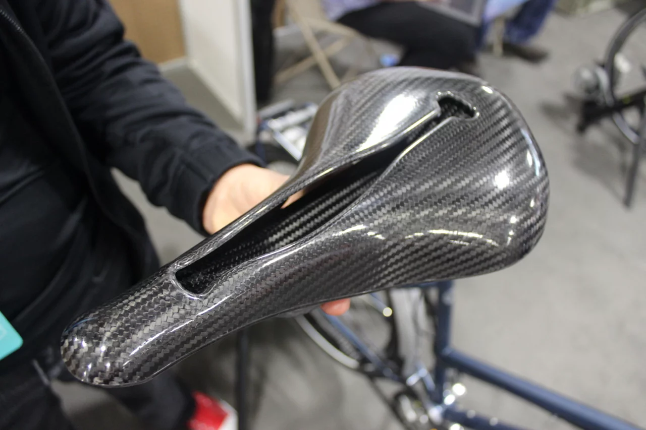 A carbon fiber saddle made by Selle Anatomica, featuring a vibration-damping inner spring structure