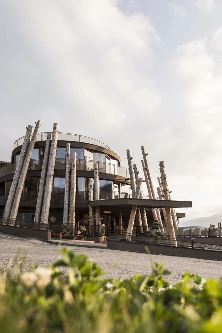 The Hubertus Hotel is an unusual-looking building, with a series of tree trunks, stripped of their bark, laid up against its facade